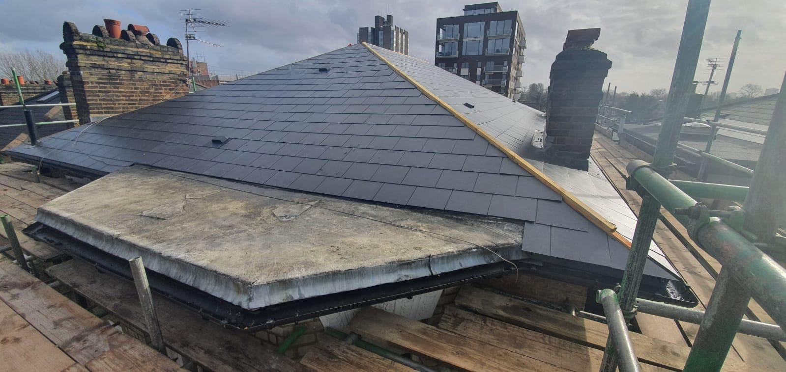 Completed dark slate roof replacement on a London property